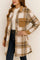 Front three-quarter view of a women’s coffee-brown and ivory plaid button-up longline coat with a shirt collar, long sleeves, flap chest pockets and slant hand pockets, rounded hem.