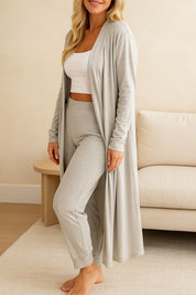 Close-up of a woman in a stylish gray loungewear set with long cardigan and joggers, perfect for relaxing at home