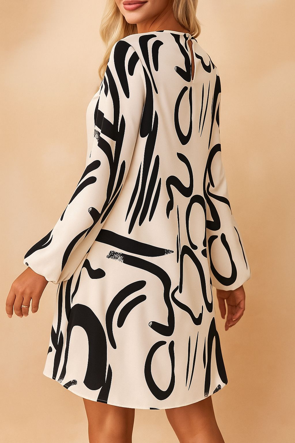 Cream abstract-print mock-neck mini dress with small keyhole fastening and clean back panel — back view.