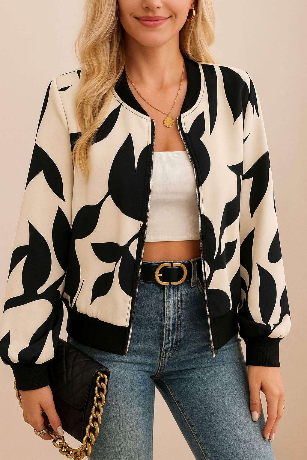Centered front view of the cream-and-black abstract-print zip-up bomber jacket with rib-knit trims and a straight hem; relaxed fit.