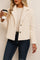 Front view of a women’s cream fuzzy button-up short jacket with a notched lapel collar, long sleeves and a straight hem.