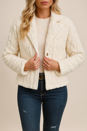 Front view of the cream fuzzy button-up short jacket worn open; notched lapel and cropped length visible.