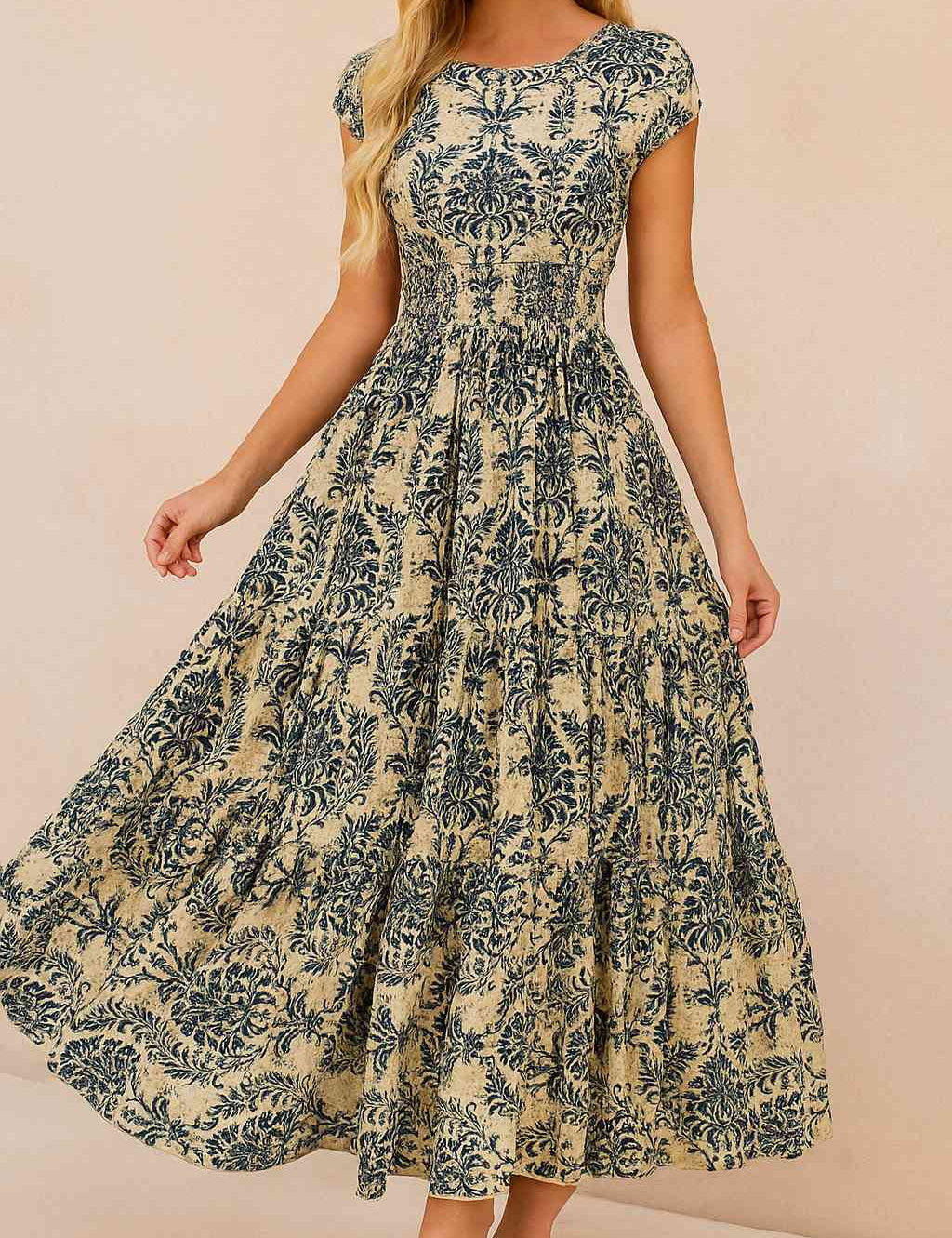 Women’s dark-blue boho-print V-neck cap-sleeve maxi dress with smocked waist and tiered hem — front view.