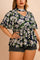 Front view of a women’s dark blue floral blouse with a V-neck cutout choker neckline, flutter short sleeves and a relaxed gathered hem (plus size)