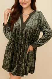 Dark-green velvet mini dress with notched V neckline, fine pleated front and side pockets — front view