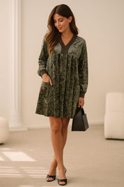 Dark-green velvet mini dress with pleated front and straight hem, relaxed silhouette — full-length front view.
