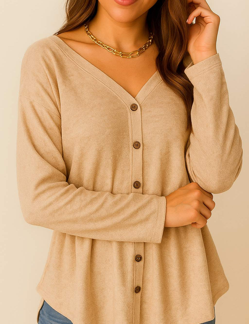 Front detail view of a women’s dust-storm beige V-neck button-front long-sleeve top with drop-shoulder seam and a soft curved hem