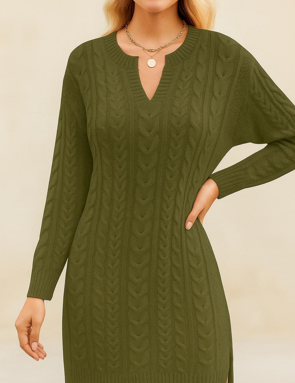 Woman wearing a green cable knit dress against a beige background