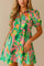 Floral button-down babydoll dress in green multi with shirt collar, puff sleeves and tiered mini skirt — front view.