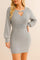 Front view of a women’s cable-knit sweater dress in heather gray with a V-neck cutout, long balloon sleeves, ribbed waistband, and a mini-length hem.
