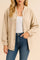 Front view of a women’s khaki corduroy snap-button jacket with rib-knit stand collar, subtle drop-shoulder long sleeves, elastic cuffs and slant welt pockets; elastic hem