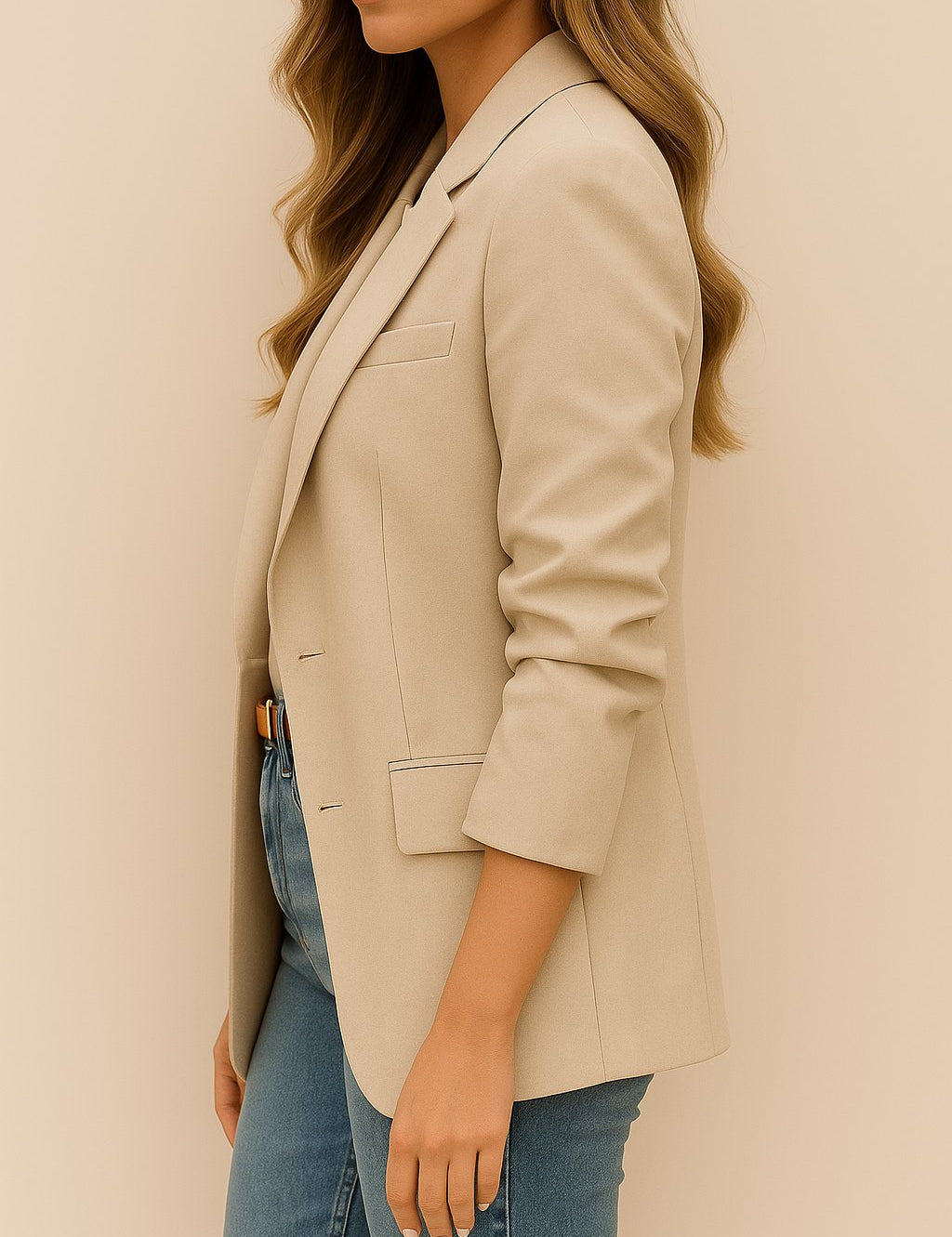 “Left side view of the khaki longline blazer showing the notched lapel, single-breasted front and flap pocket at the hip.