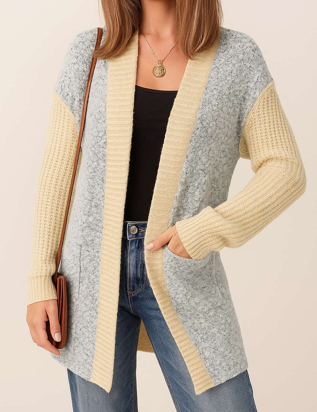 Front view of a women’s light-gray and pastel-yellow colorblock open-front cardigan with ribbed trim, long sleeves and patch pockets.