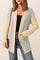 Front view of a women’s light-gray and pastel-yellow colorblock open-front cardigan with ribbed trim, long sleeves and patch pockets.