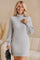 Women’s light-gray ribbed turtleneck knit mini dress with dropped shoulders, long sleeves and straight hem — front three-quarter view