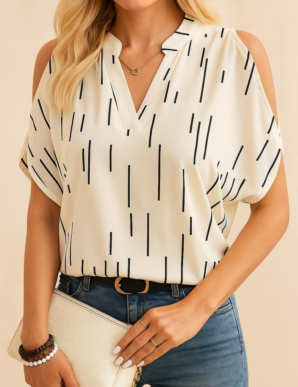 Front view of a women’s multicolor cold-shoulder blouse with a notched V-neck and short sleeves; abstract line print and easy, relaxed drape