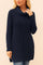 Front view of the navy waffle-knit turtleneck tunic sweater featuring long sleeves, relaxed body and side slits at the hem