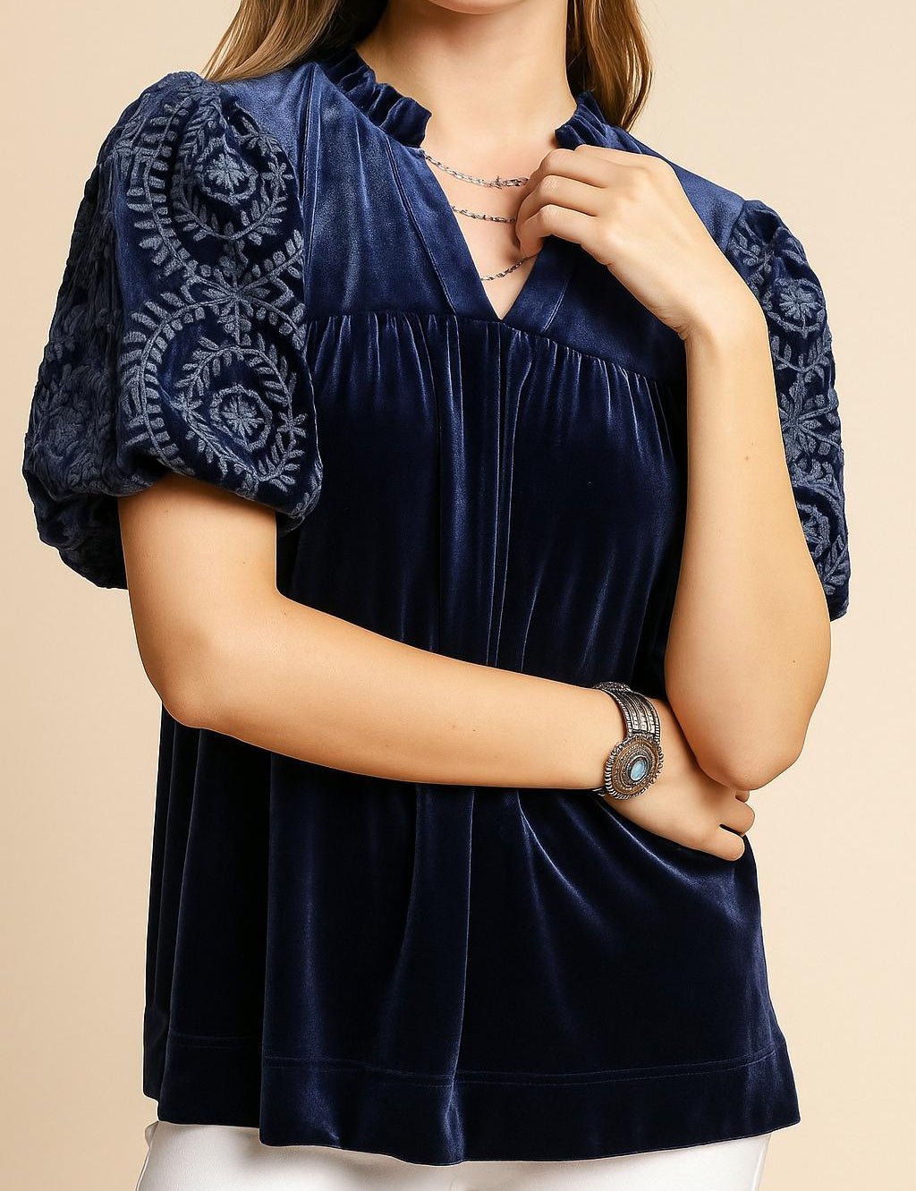 Women’s navy velvet blouse with embroidered puff sleeves and soft notched V neckline — front detail view