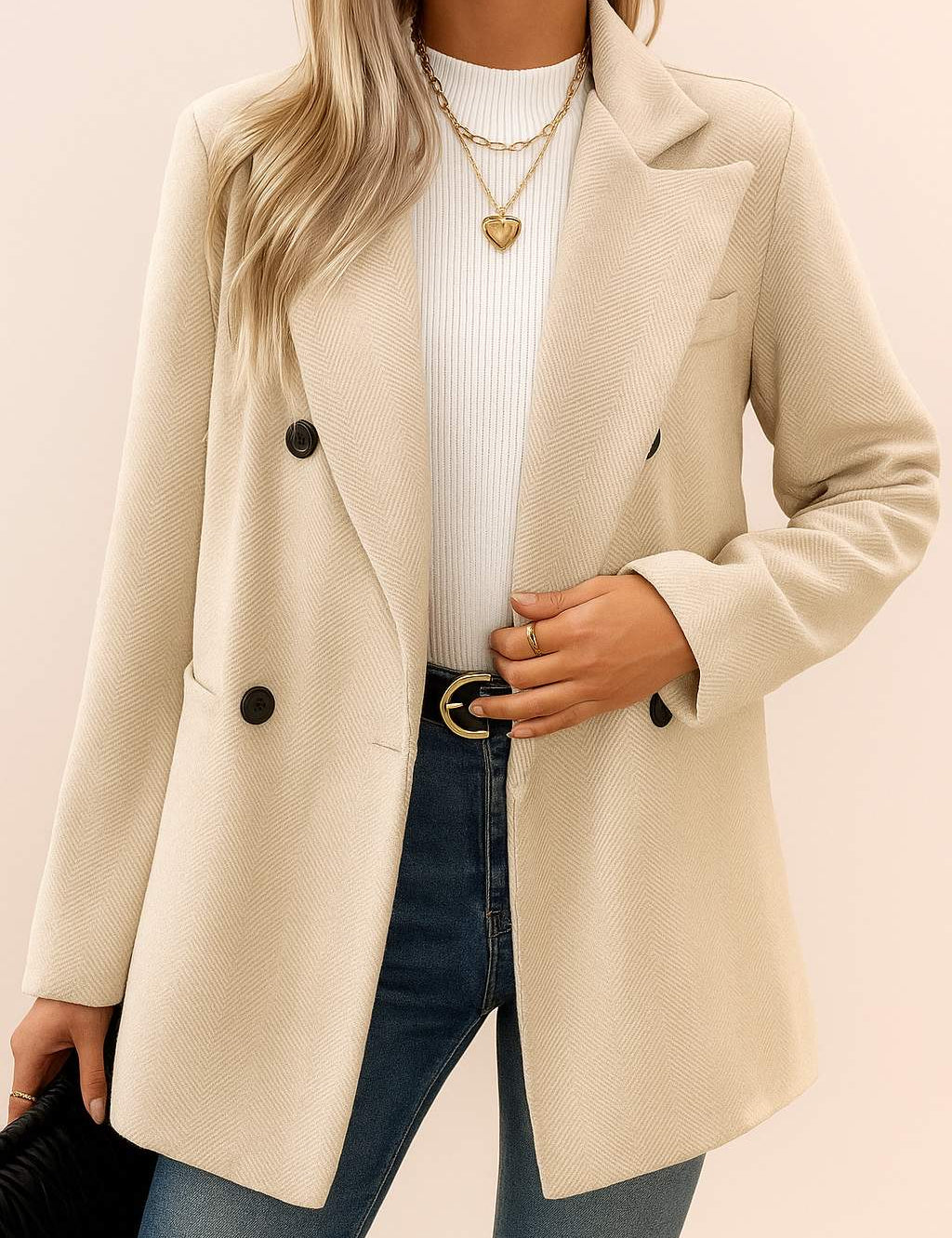 Front view of the oatmeal beige herringbone double-breasted coat with notched lapel, open front stance, long sleeves and welt pockets.
