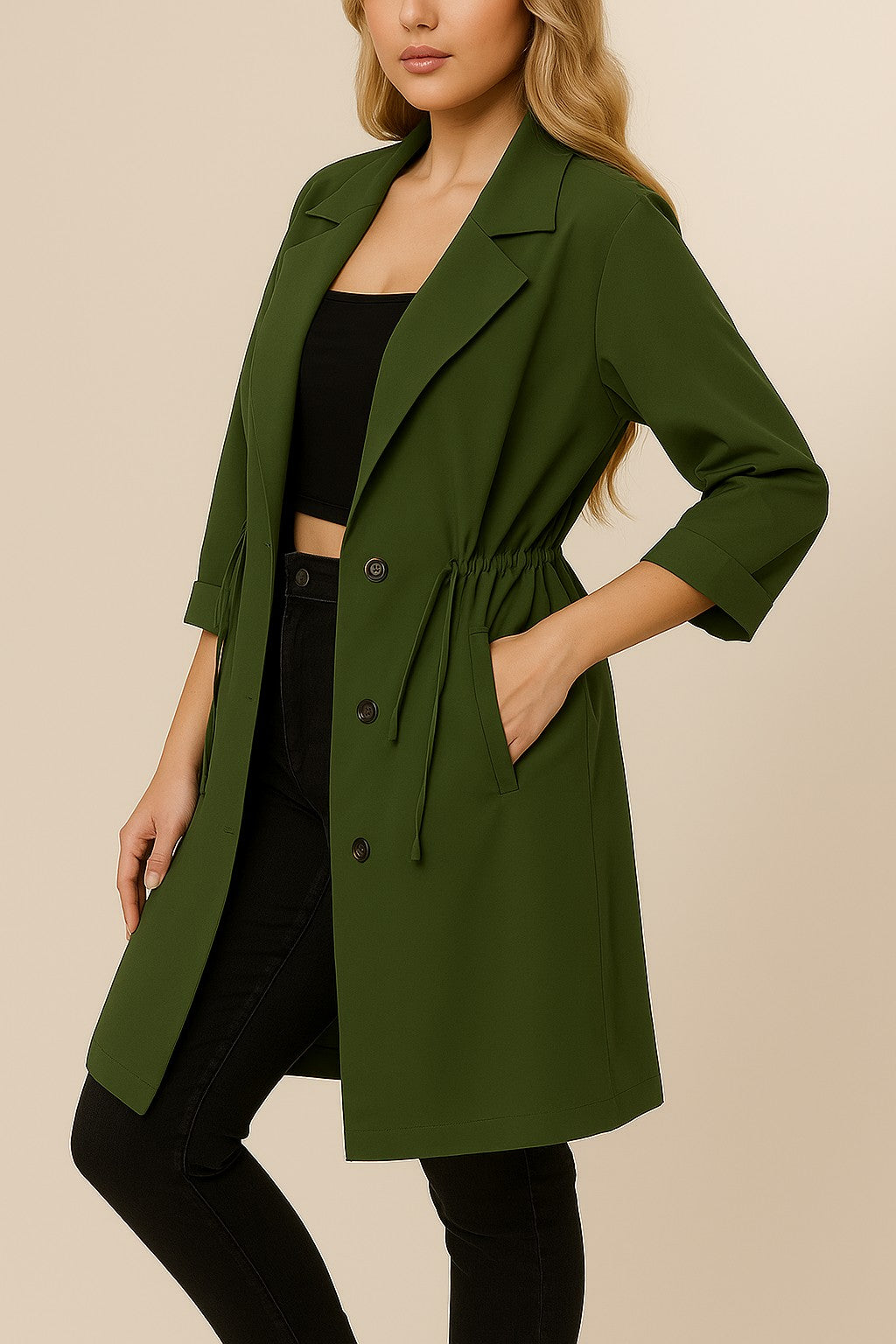Left three-quarter view of the olive green plus-size lapel trench coat showing roll-tab sleeve, drawstring waist and slant welt pocket