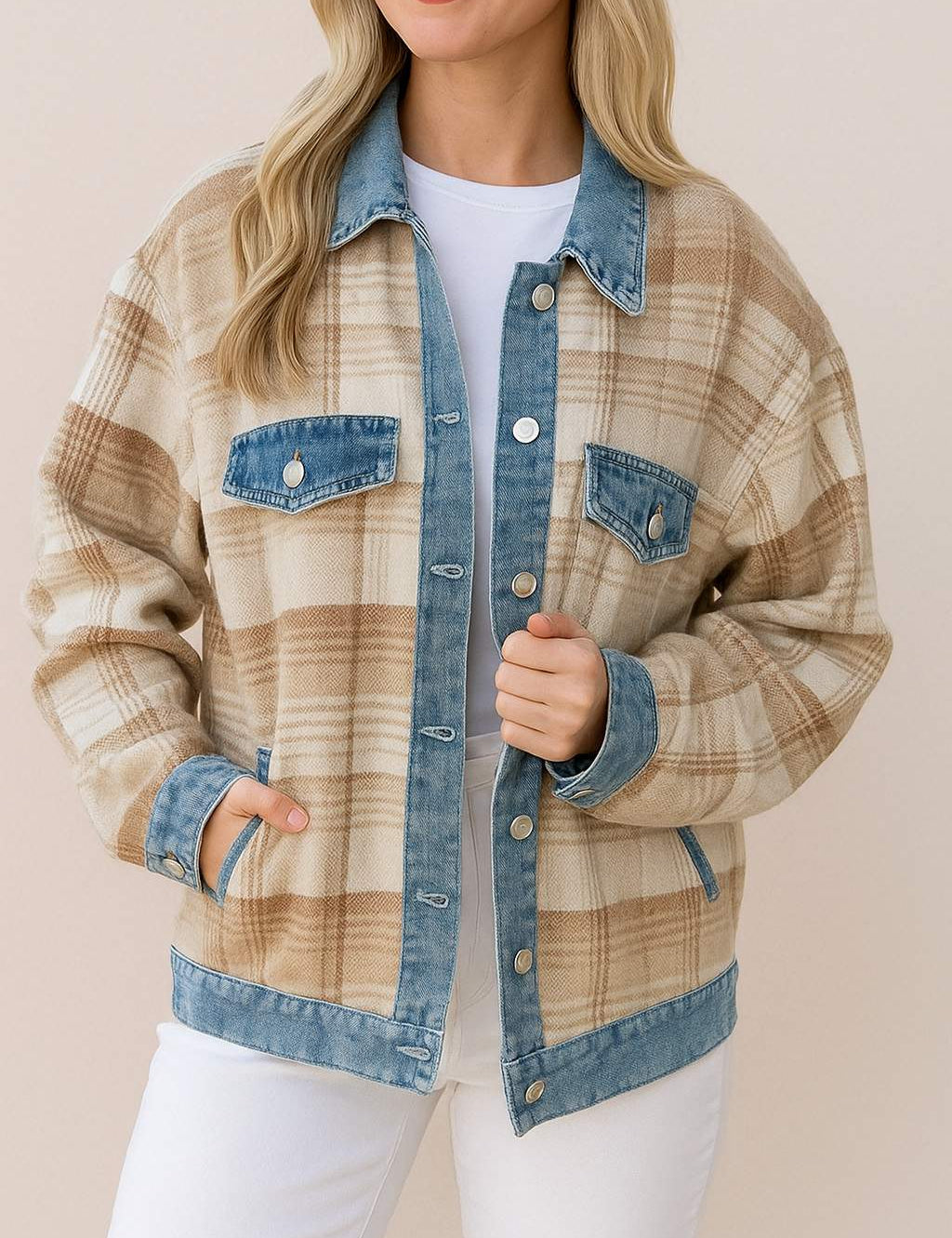 Front three-quarter view of a women’s plaid shacket with denim collar, placket, cuffs and hem, chest flap pockets and side pockets.