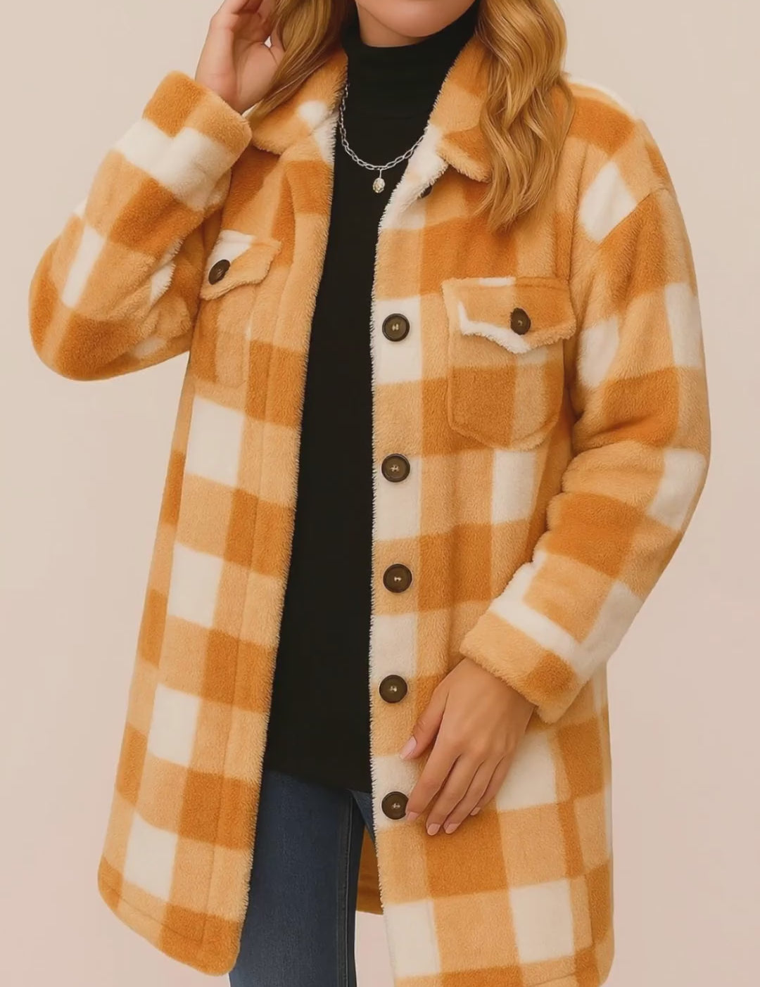 Short lookbook video showing the camel-and-ivory buffalo-check button-front coat with shirt collar, flap chest pockets and patch pockets, from front and back views.