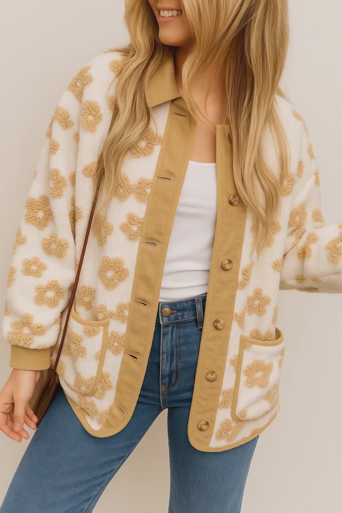 Short lookbook video of an ivory sherpa jacket with camel floral texture, corduroy trim, button-front, patch pockets and ribbed cuffs, shown in studio lighting