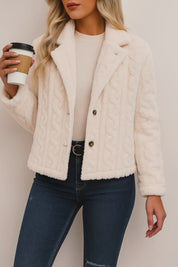 Short lookbook video of a cream fuzzy button-up short jacket with a notched lapel collar and long sleeves, shown in studio lighting.