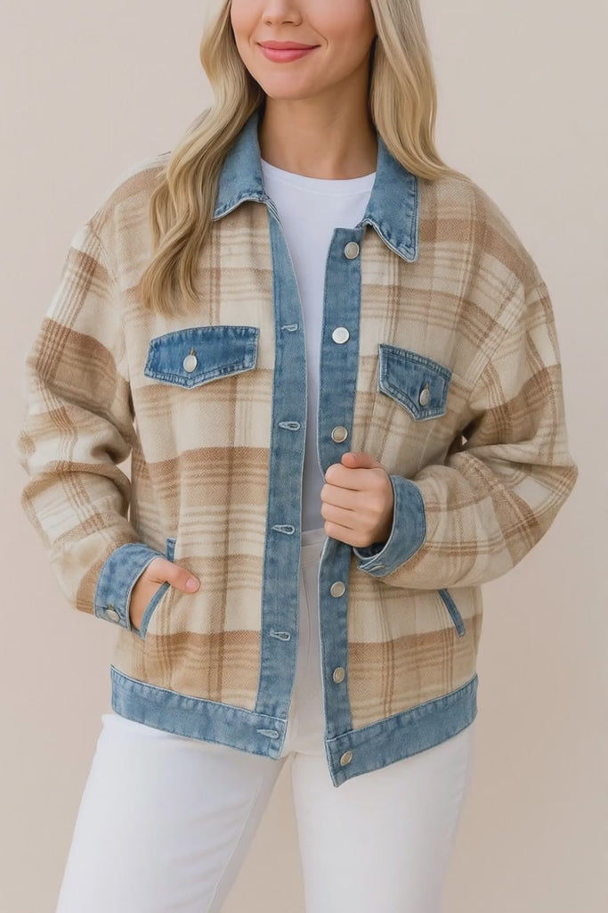Short studio video of the plaid shacket with denim collar, placket, cuffs and hem, shown on a model without additional props.