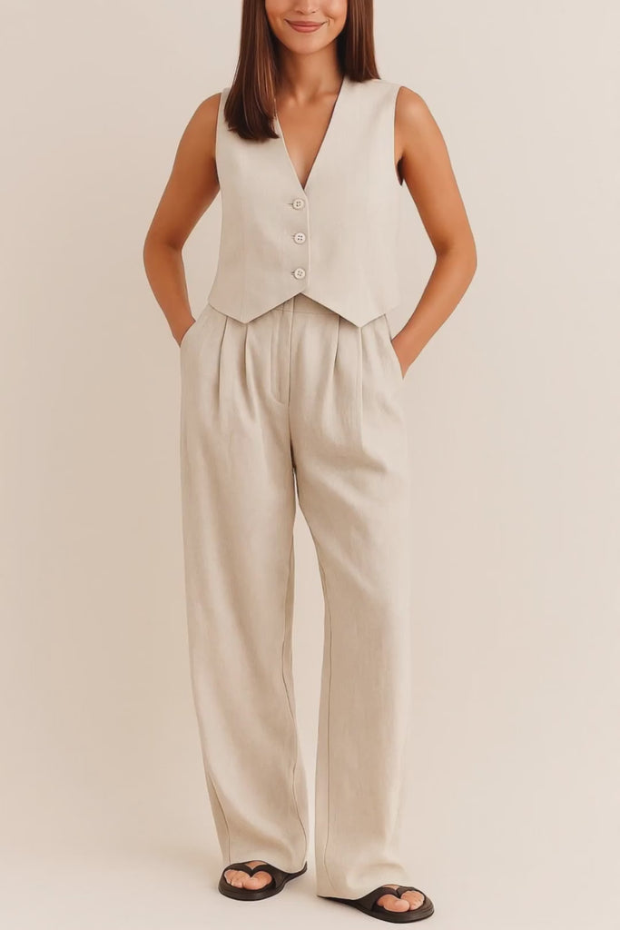 Front view of an apricot sleeveless V-neck vest and pleated wide-leg pants set with button closure and side pockets.
