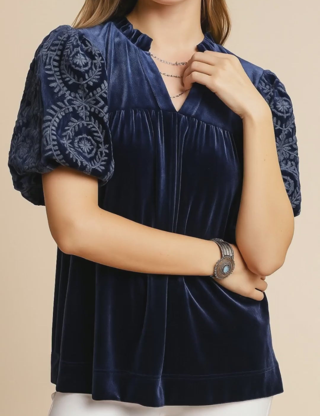 Navy velvet blouse with embroidered puff sleeves and notched V neckline, relaxed fit — studio lookbook video.