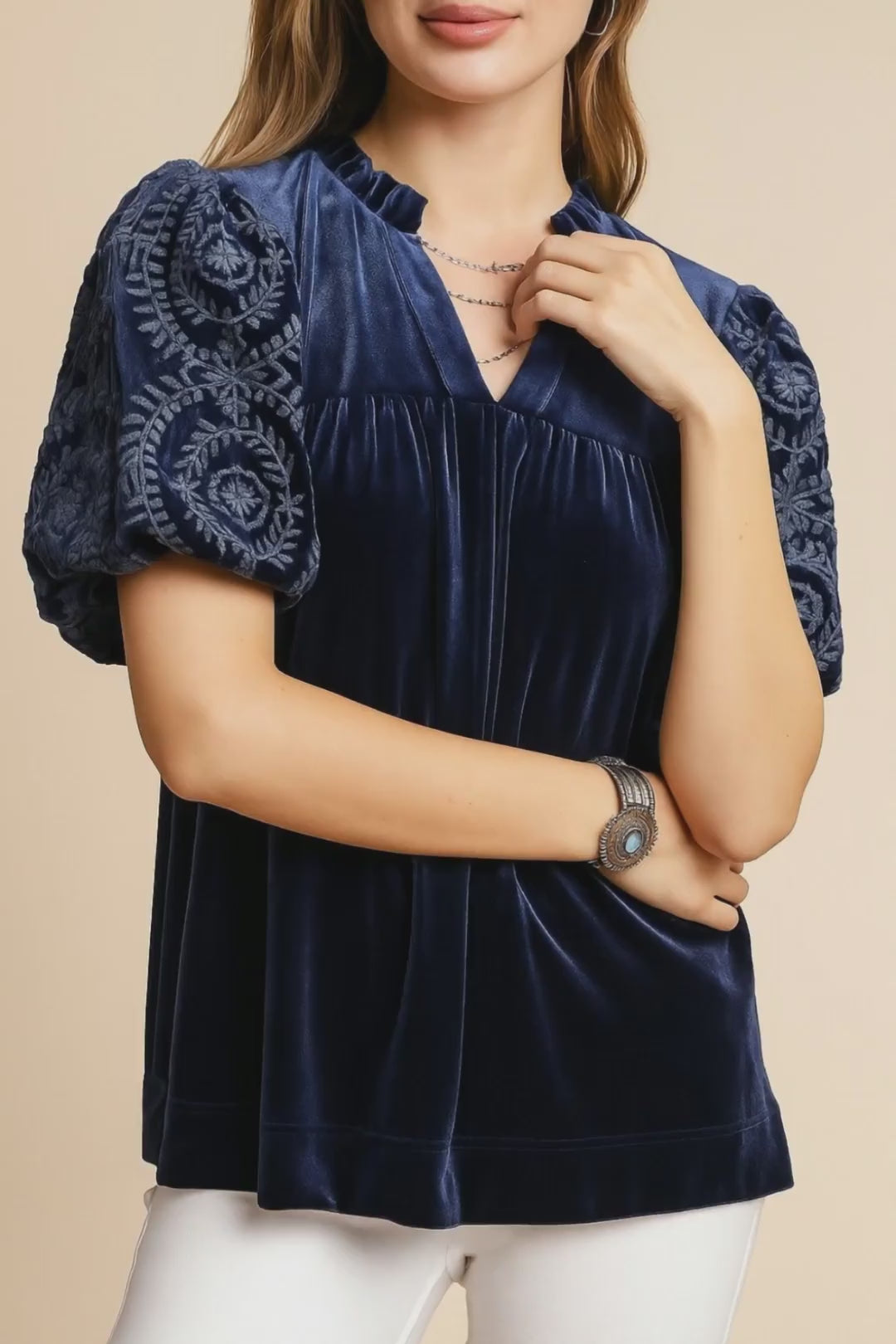 Navy velvet blouse with embroidered puff sleeves and notched V neckline, relaxed fit — studio lookbook video.