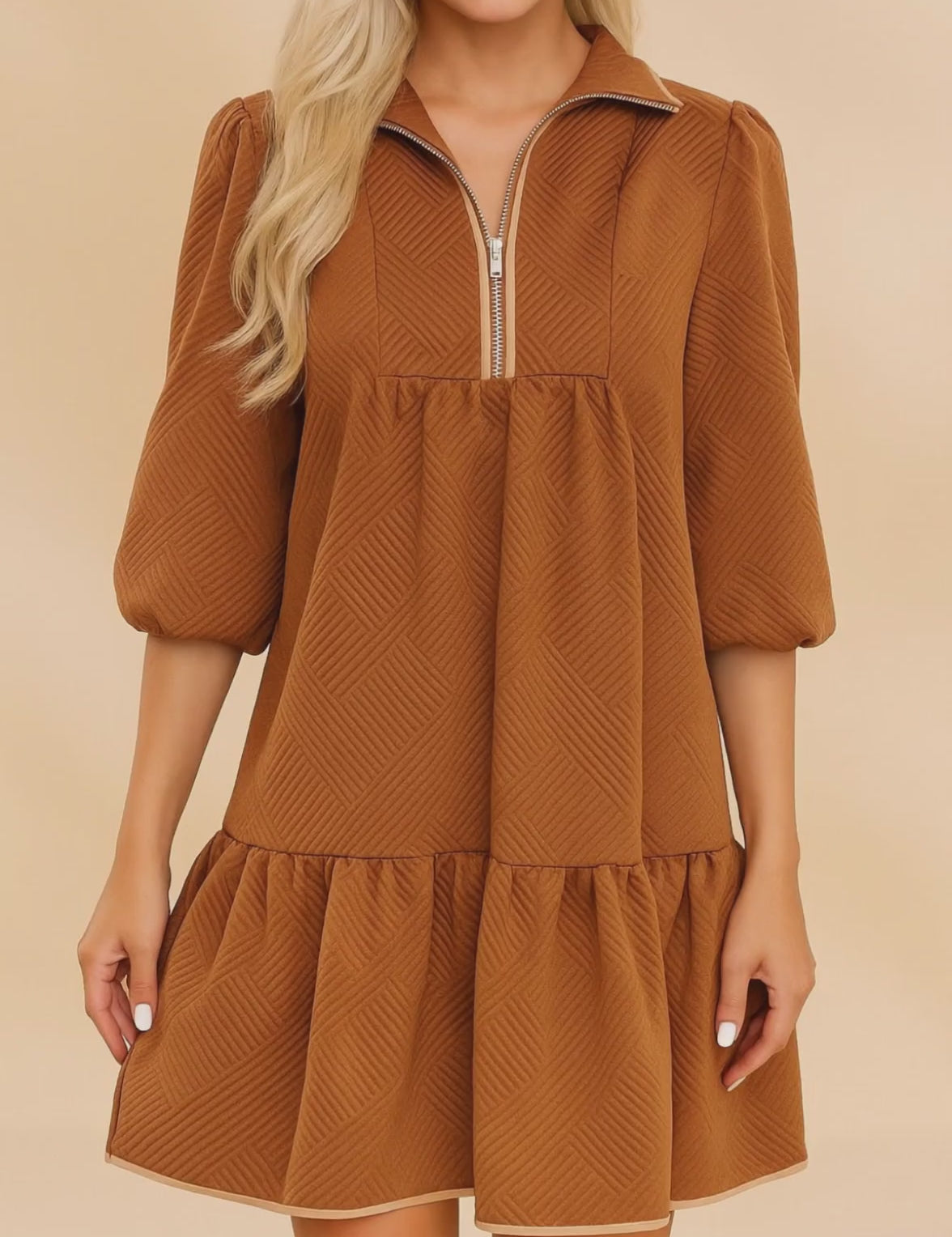 Short video showcasing a women’s chevron-textured mini dress with a collared half-zip neckline, puff three-quarter sleeves, and a relaxed swing ruffle hem.