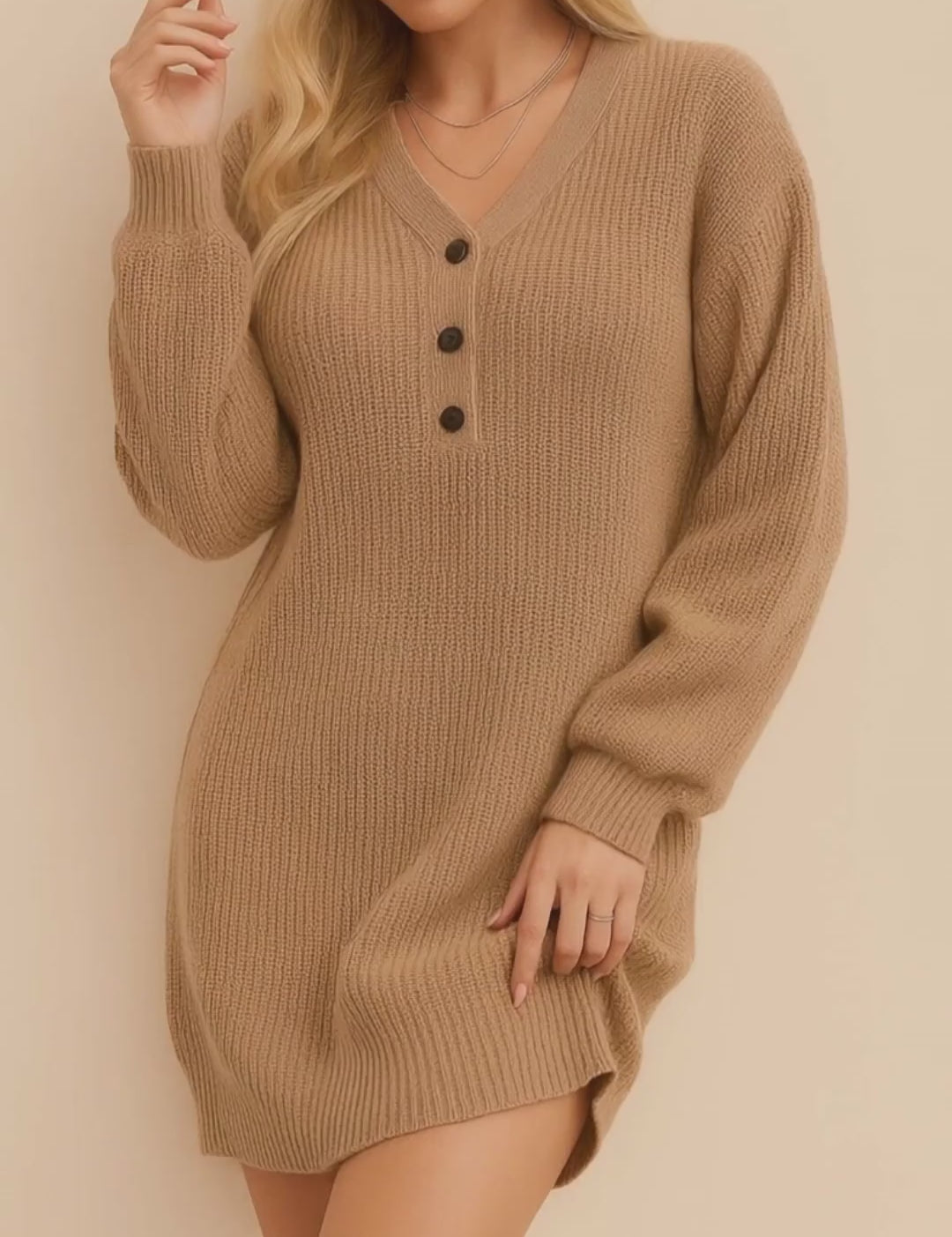 Short lookbook video showcasing a women’s waffle-knit henley sweater dress with a V-neck and three-button placket, long balloon sleeves, ribbed cuffs and hem, and an above-knee relaxed fit in clean studio lighting.