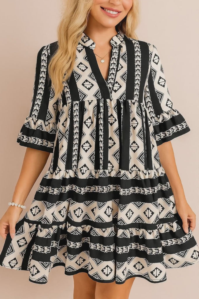 Black-and-white boho geometric tiered mini dress with notched neckline and flared half sleeves — studio lookbook video
