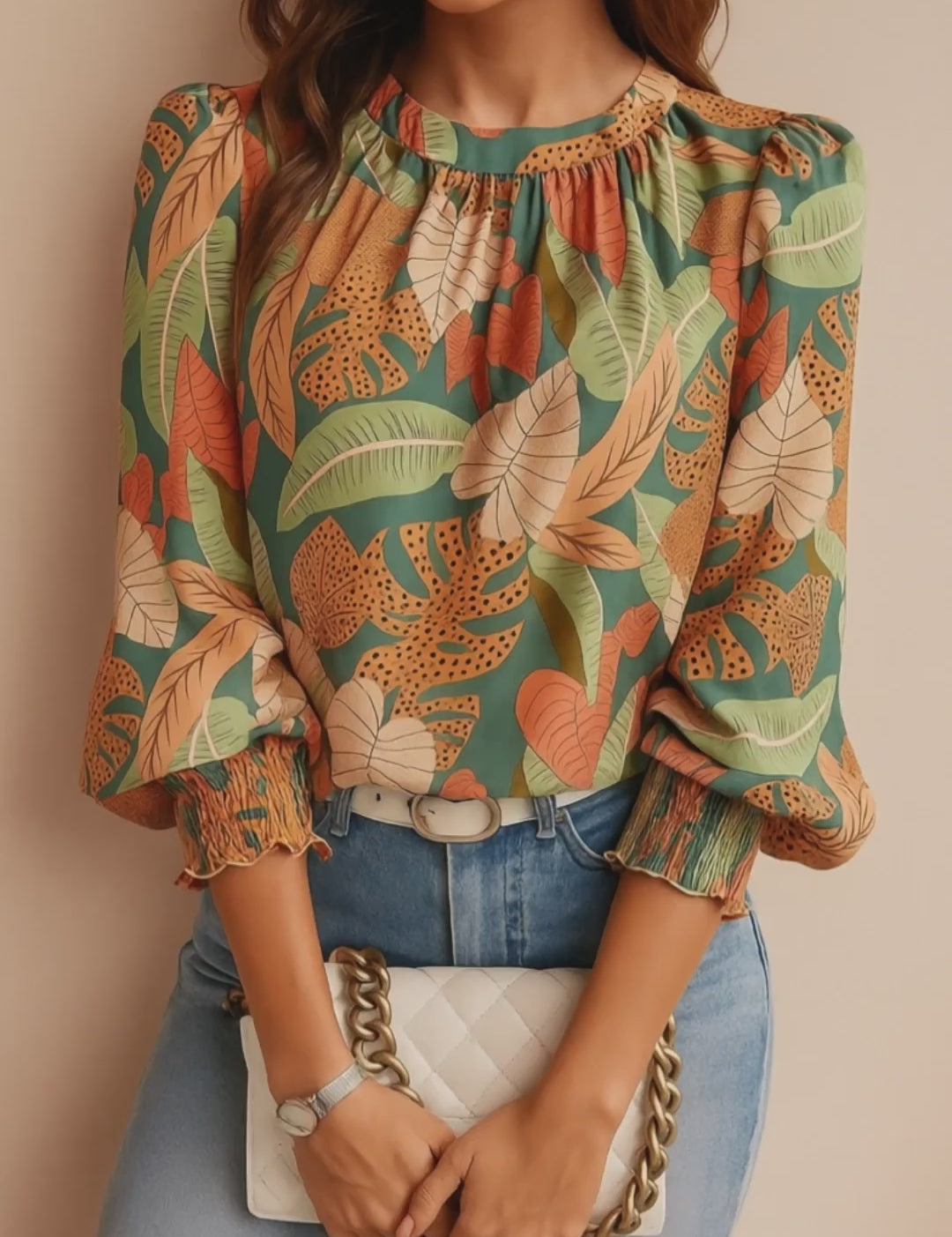 Green tropical leaf-print long-sleeve blouse with gathered crew neckline, smocked cuffs and relaxed drape — studio lookbook video