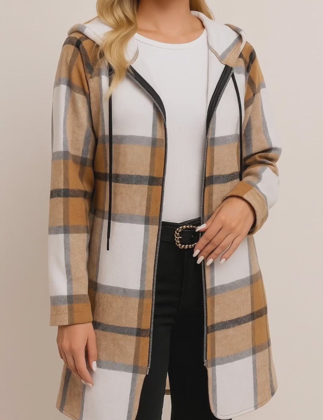 Short lookbook video of a camel and white plaid zip-up hooded coat with drawstring hood, drop-shoulder sleeves and side hand pockets, shown in studio lighting.