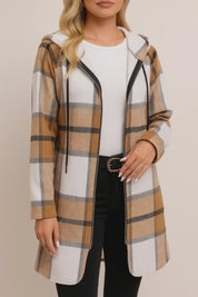 Short lookbook video of a camel and white plaid zip-up hooded coat with drawstring hood, drop-shoulder sleeves and side hand pockets, shown in studio lighting.