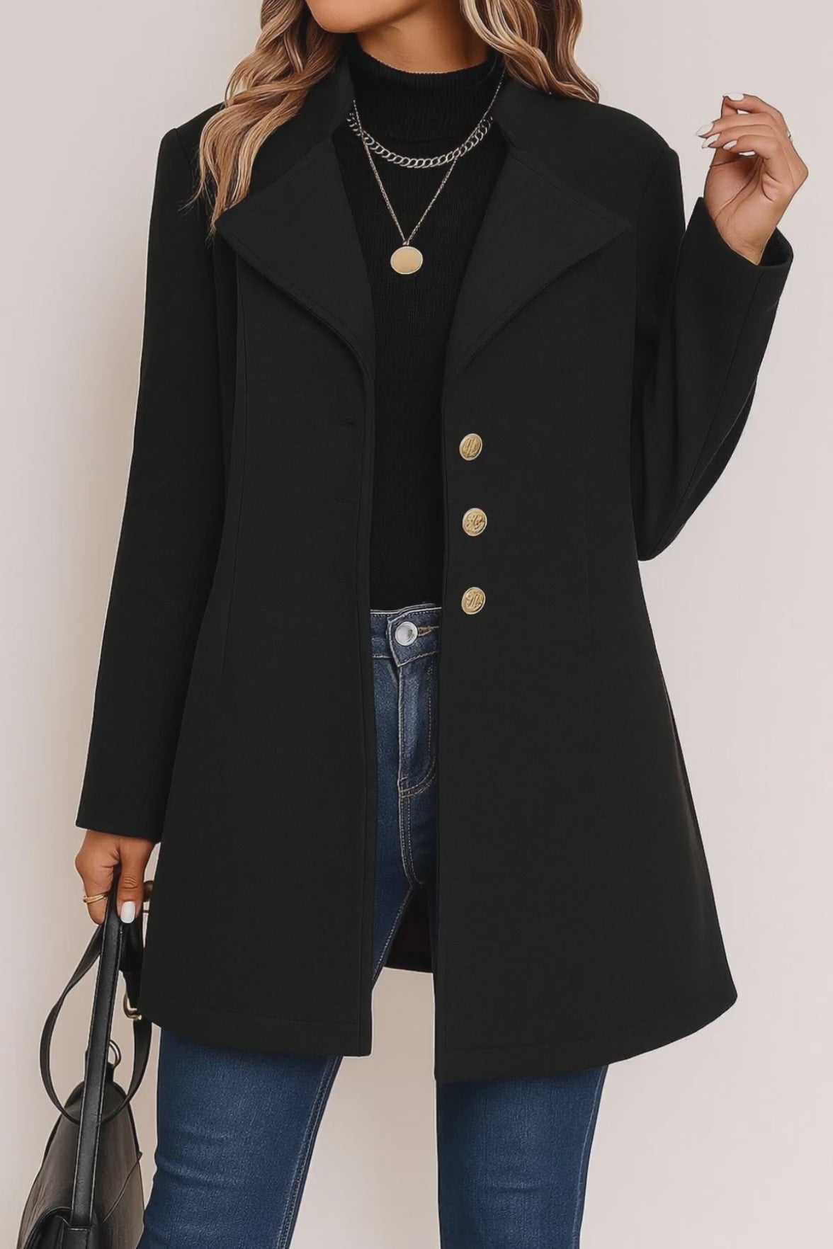 Short lookbook video showing the black tailored button-up coat with notched lapel, gold-tone buttons and straight hem from front and back views.