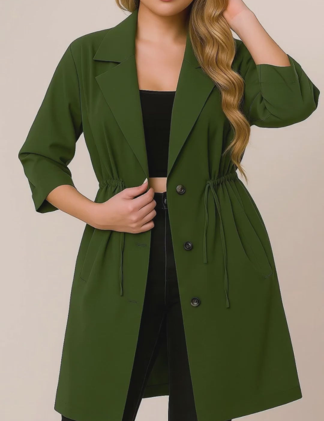 Short lookbook video of an olive green plus-size lapel trench coat featuring roll-tab sleeves, drawstring waist and slant welt pockets, shown in studio.