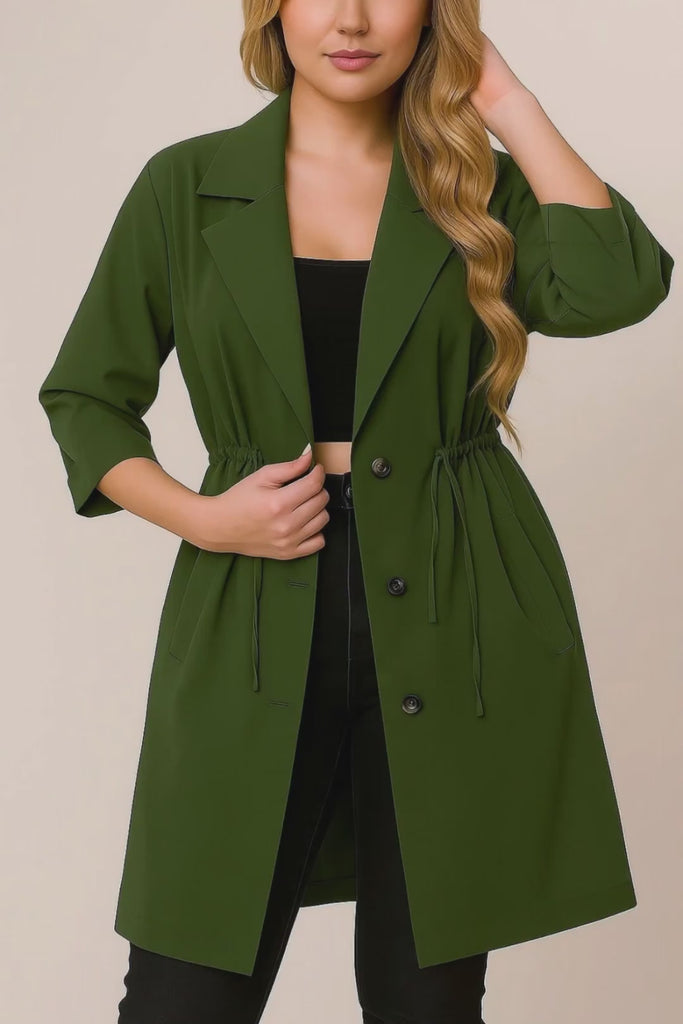 Short lookbook video of an olive green plus-size lapel trench coat featuring roll-tab sleeves, drawstring waist and slant welt pockets, shown in studio.