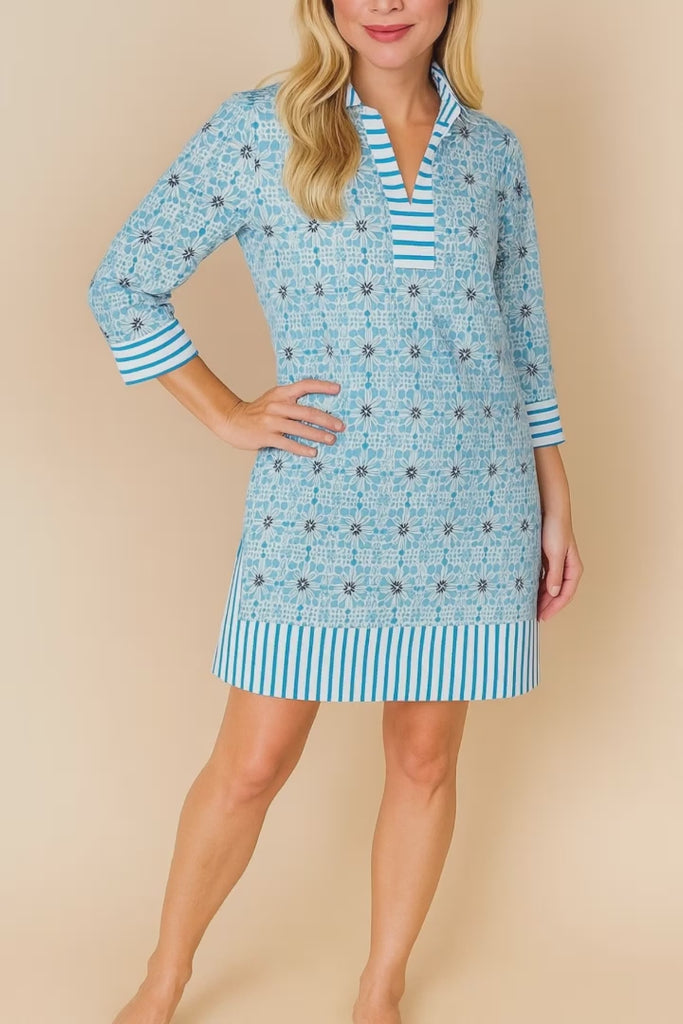 Pastel-blue floral tunic dress with split V-neck and striped trim at collar, cuffs and hem, three-quarter sleeves — studio lookbook video.