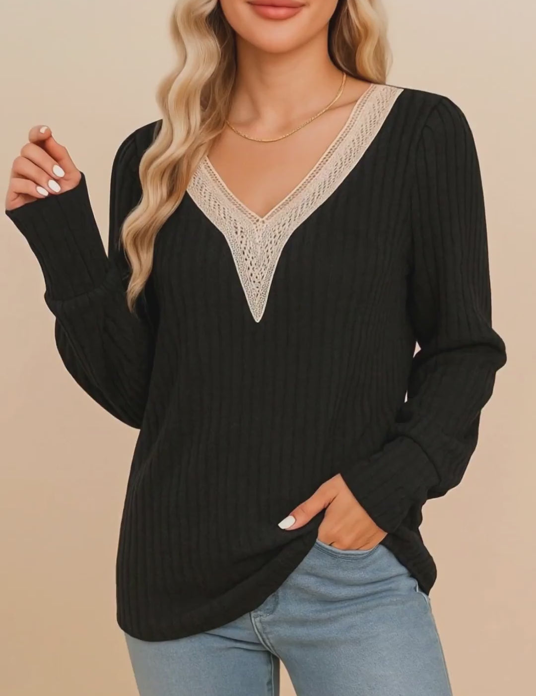 Short lookbook video showing a black ribbed V-neck blouse with beige crochet trim and long sleeves from front and detail views.