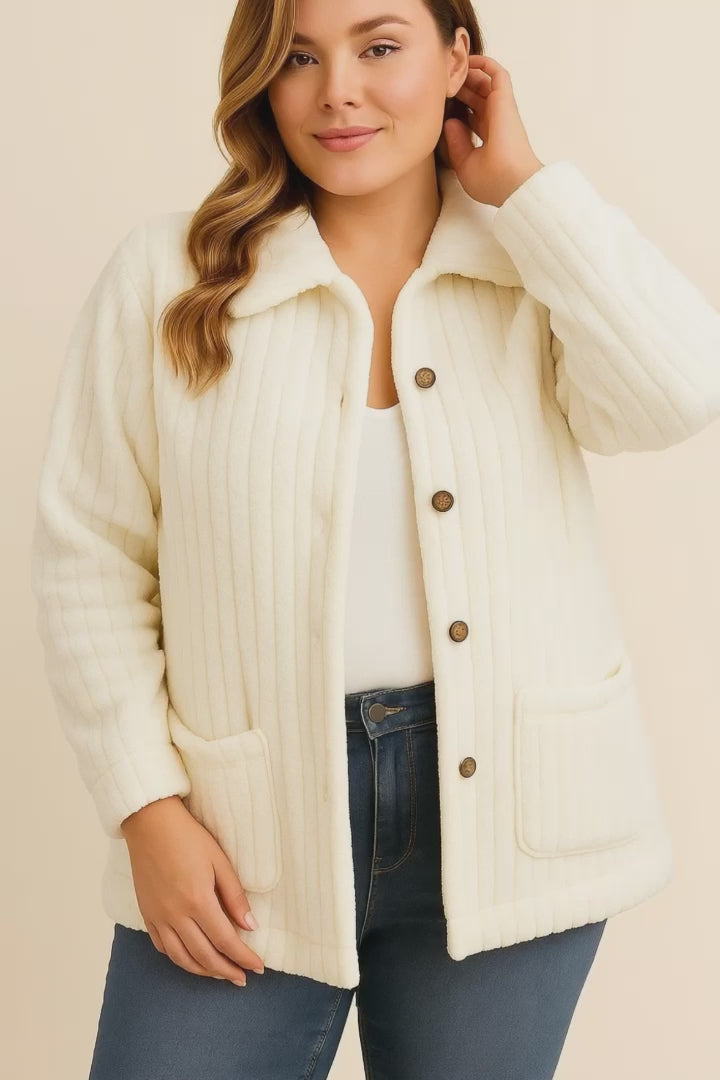 Short lookbook video of a white fuzzy collared button-down jacket with drop-shoulder sleeves and front patch pockets, shown in studio lighting.