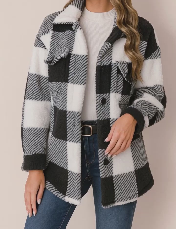 Short lookbook video showing the black-and-white fuzzy plaid button-up jacket with drop-shoulder sleeves, shirt collar and flap chest pockets, from front and back views.