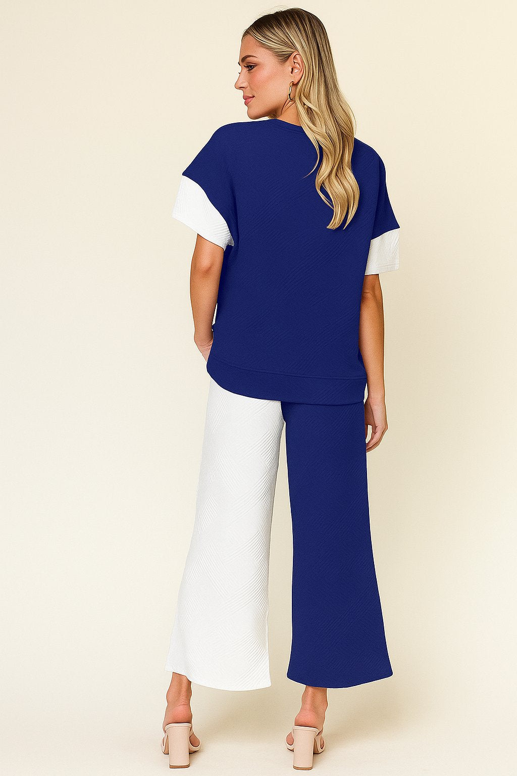 Back view of the royal-blue and white colorblock textured top and wide-leg pants set