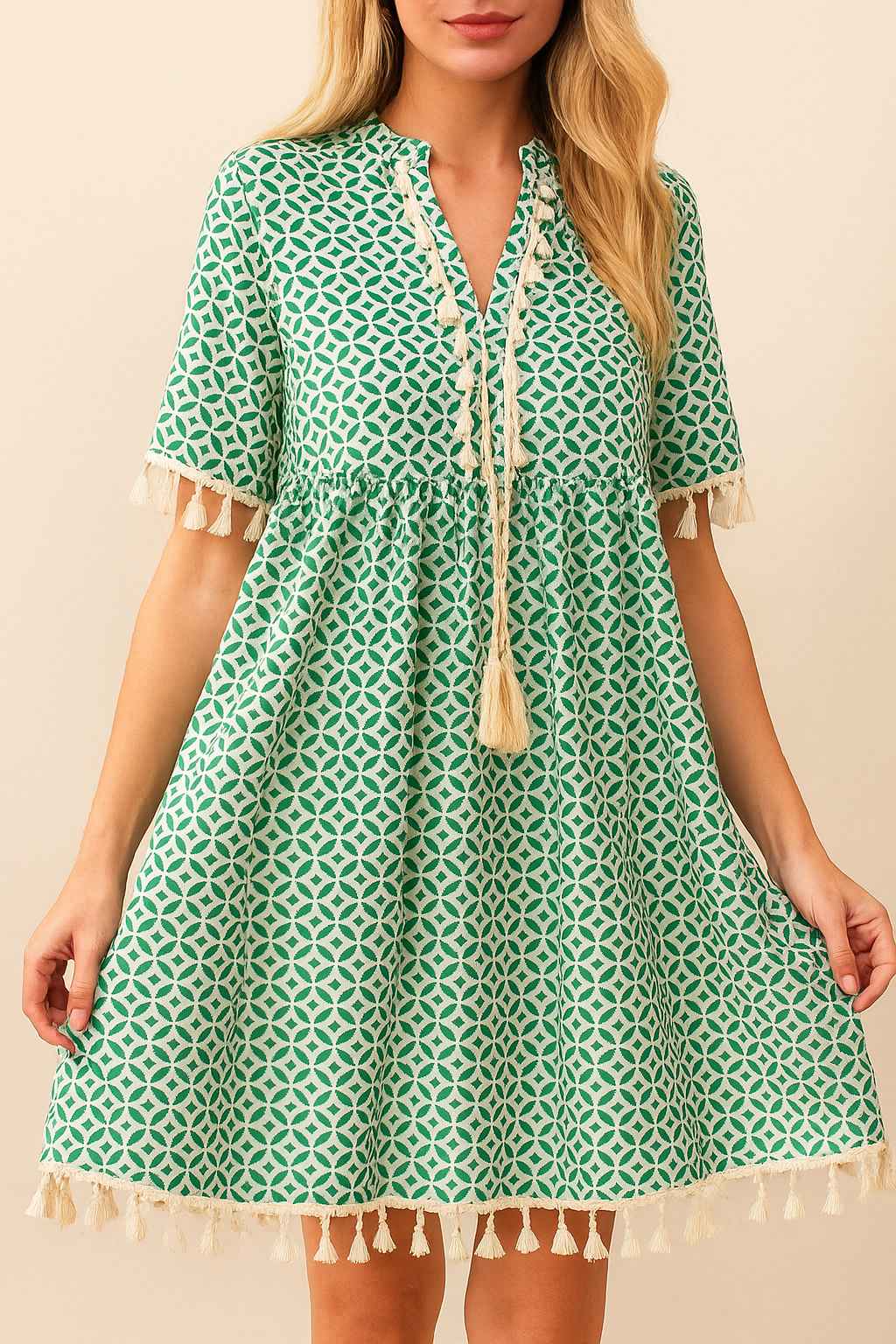 turquoise-geometric-print-tassel-trim-mini-dress-tassel-hem-empire-seam-front-view-holding-hem