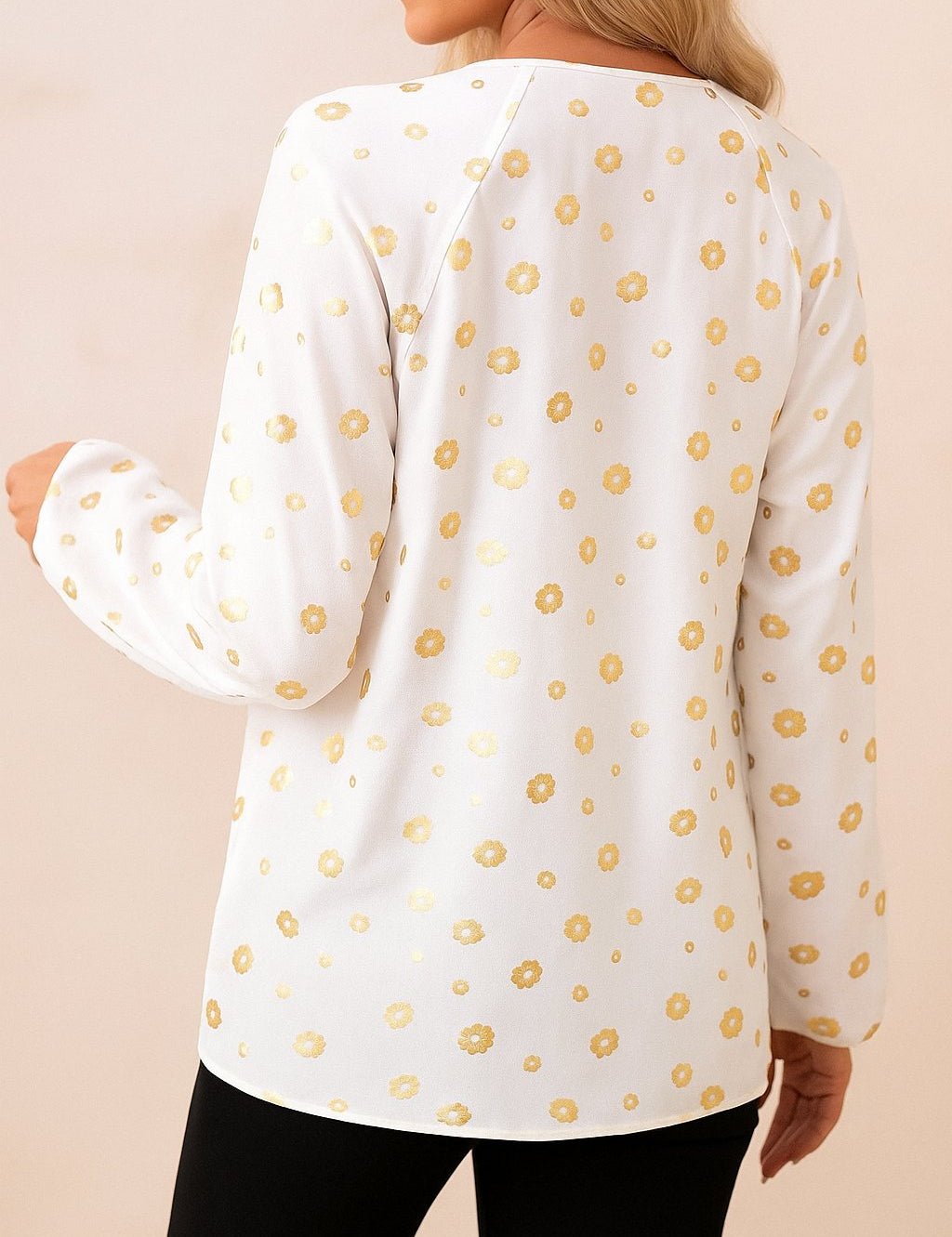 White tie-neck blouse with gold-foil dot print, relaxed fit and curved hem — back view.